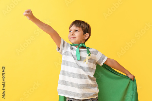 Little boy with golden ribb...