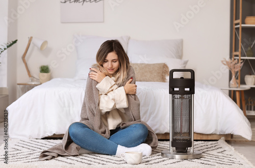 Young woman in warm clothes...