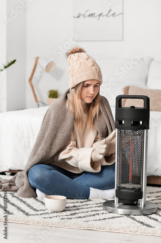 Young woman in warm clothes...