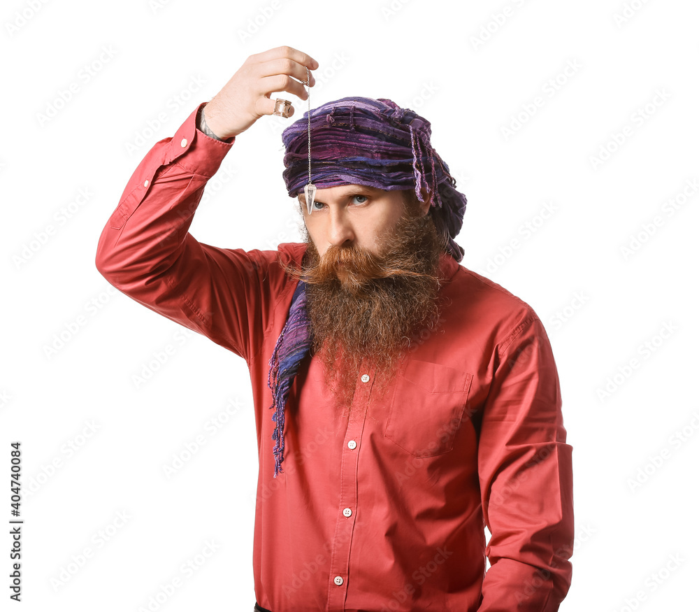 Male fortune teller with pendulum on white background