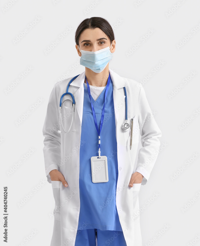 Portrait of female doctor on light background Portrait of female doctor on light background
