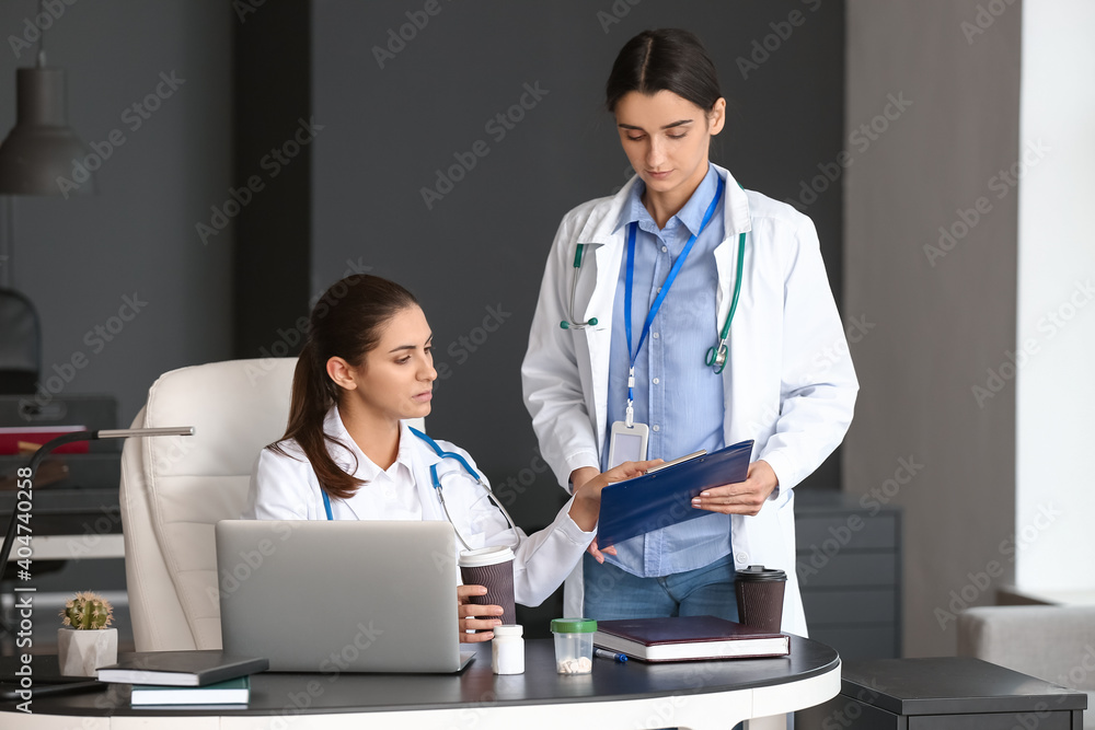 Portrait of female doctors in clinic Portrait of female doctors in clinic