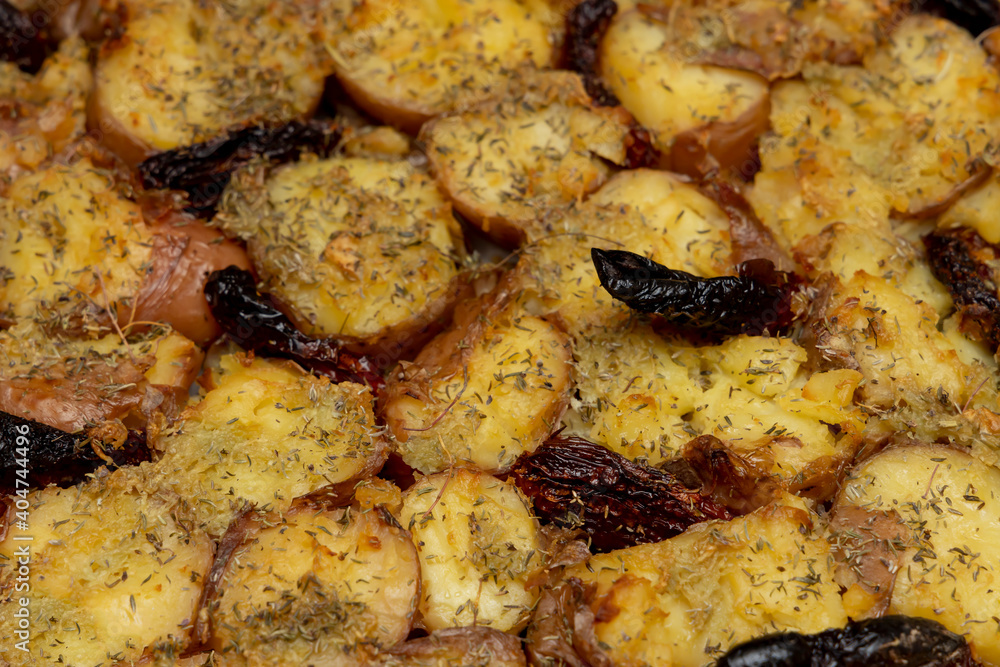 Baked potatoes with cheese and spices. Baked potatoes with cheese and spices.