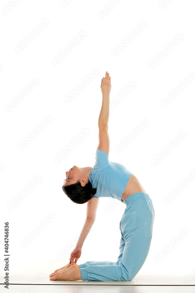 Woman doing yoga exercise isolated on white. Woman doing yoga exercise isolated on white.