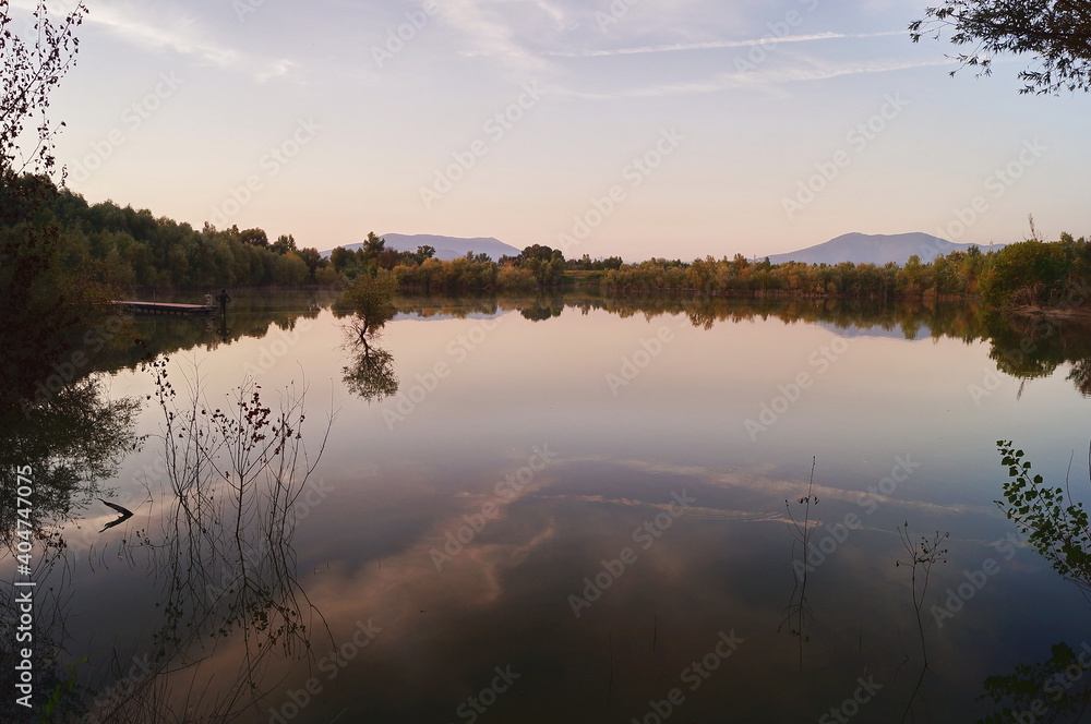 Lake in Renai park at sunset, Tuscany, Italy