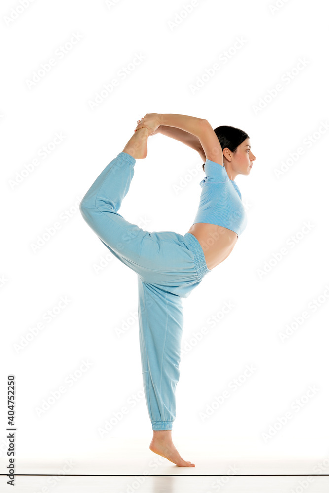 Fit yoga woman doing yoga pose, isolated on white background. Fit yoga woman doing yoga pose, isolated on white background.