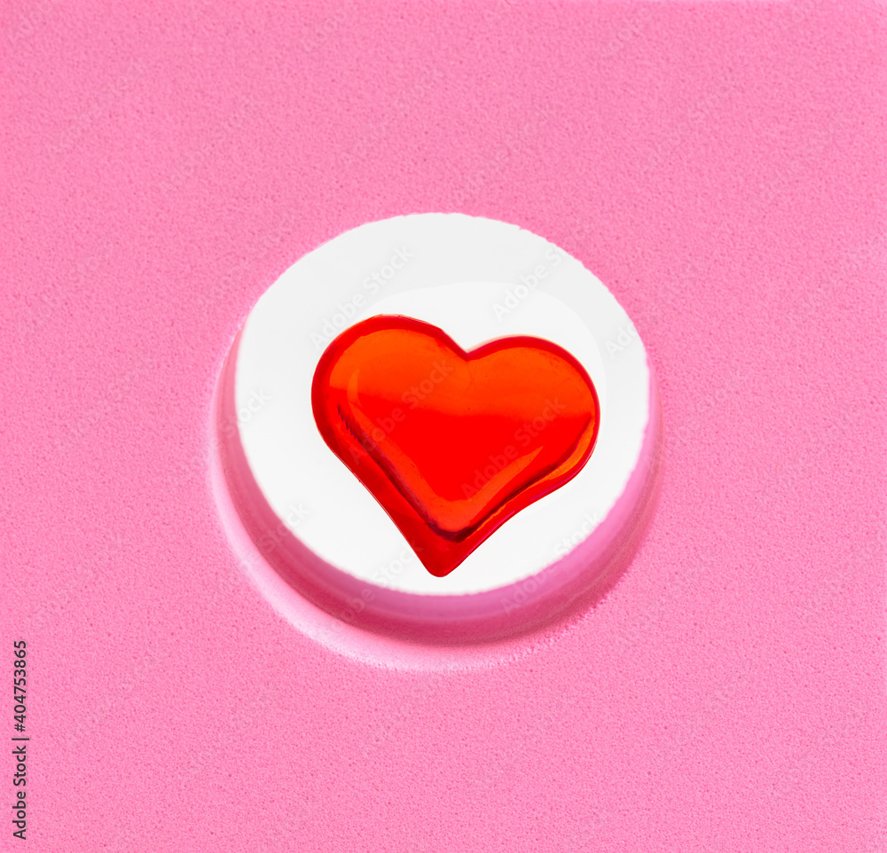 Red heart in the center of a pink square.
