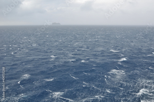 Cruise ship entering a storm in the ocean 