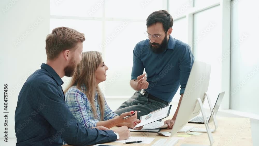 happy business team discussing financial data. close up. happy business team discussing financial data. close up.