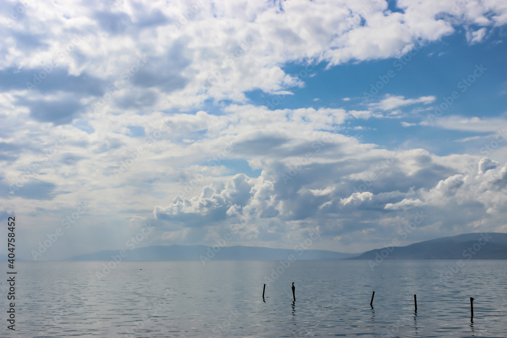 Beautiful clouds in the blue sky and birds Lake Iznik Iznik, Turkey.