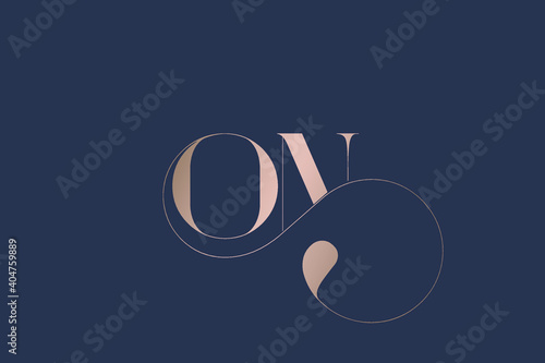 ON monogram logo.Abstract typographic wedding, beauty icon.Decorative luxury letter o and letter n.Lettering sign isolated on dark fund.Alphabet initials.Rose gold uppercase characters.Swirl line. photo