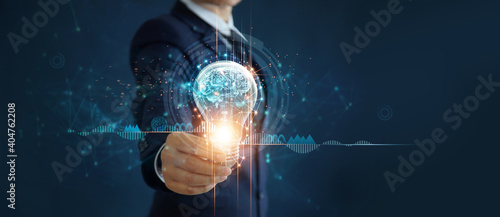 Businessman holding light bulb and brain inside, Idea and imagination, Creative and inspiration, Science innovation with network connection, Solution analysis and development, Innovative technology.
