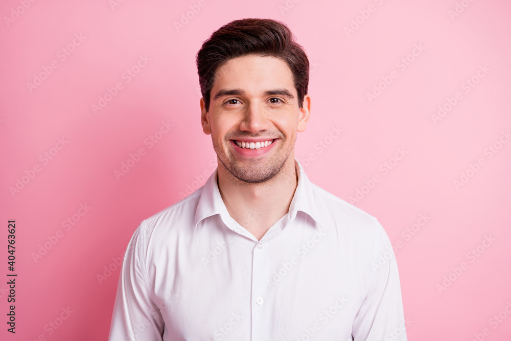 Photo of satisfied young person smile look camera wear shirt isolated on pastel pink color background Photo of satisfied young person smile look camera wear shirt isolated on pastel pink color background