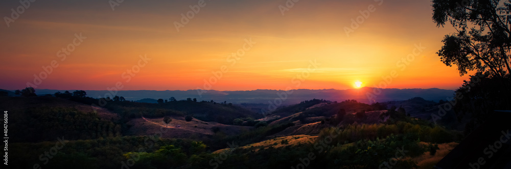 scenic landscape of mountains and mist at sunset time in Nan Province, Thailand.