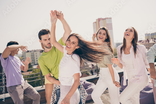 Photo of young excited attractive friends couple dance enjoy music happy smile laugh summer time party