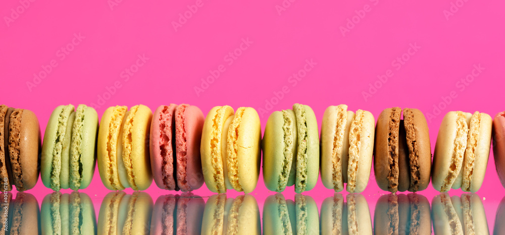 Colorful french macarons on background