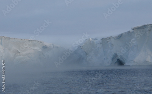 Antarctica ice cold icebergs sea and blue sky