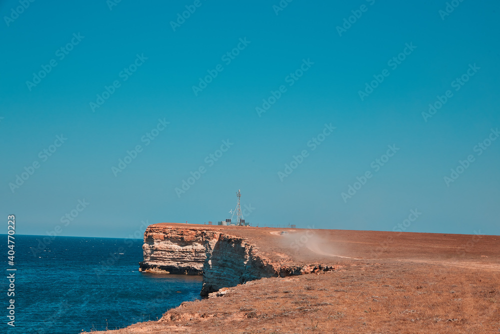 steep edge of a flat hill overlooking the sea