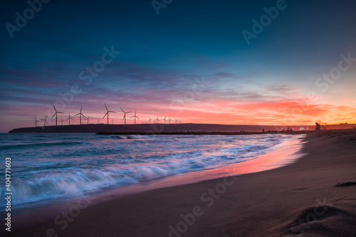 Fototapeta Naklejka Na Ścianę i Meble -  Wind turbines motion landscape sunset at sea