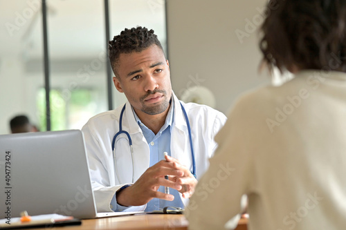 Practitioner in office with patient during medical consultation