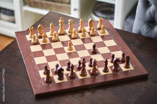 Luxury chess set. Chess pieces on the wood board.