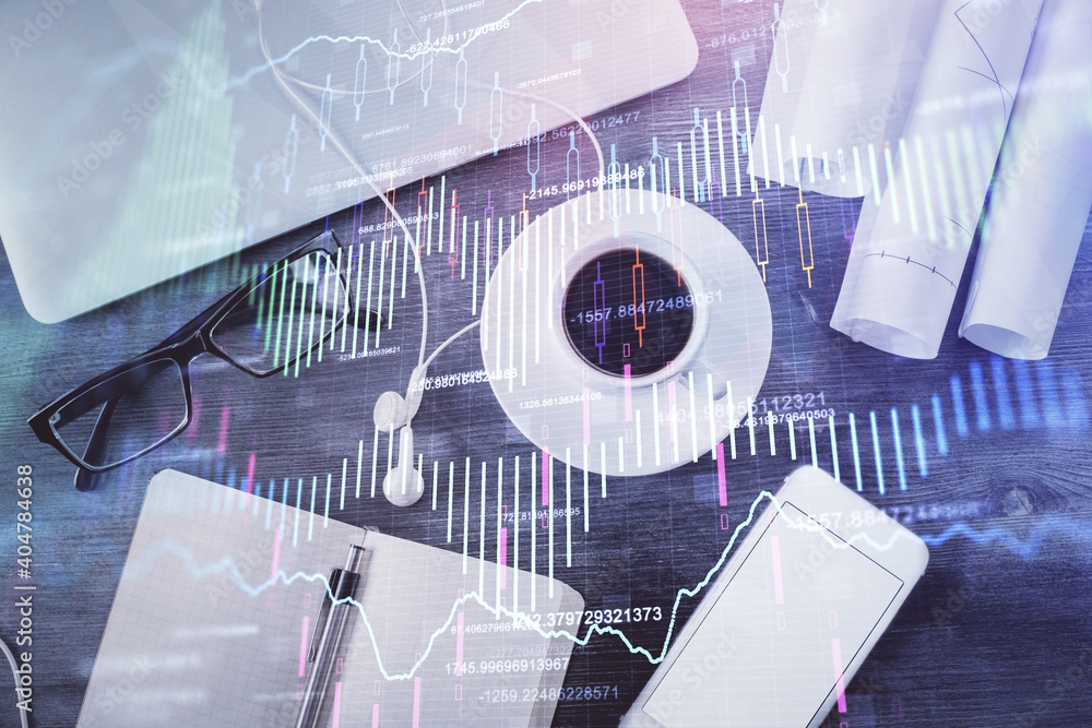 Multi exposure of forex graph drawing over desktop background with computer. Concept of financial analysis. Top view. Multi exposure of forex graph drawing over desktop background with computer. Concept of financial analysis. Top view.
