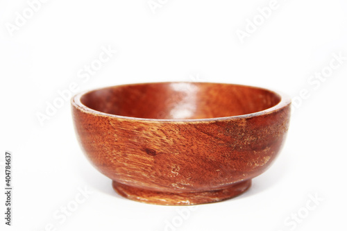brown deep wooden plate on white background