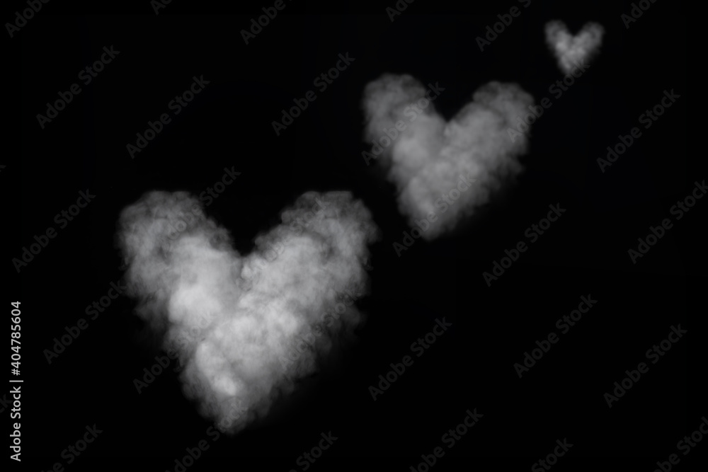 Three white smoke heart shape isolated on black background. Curly smoke for Valentine's Day on a dark background. Abstract background, design element Three white smoke heart shape isolated on black background. Curly smoke for Valentine's Day on a dark background. Abstract background, design element