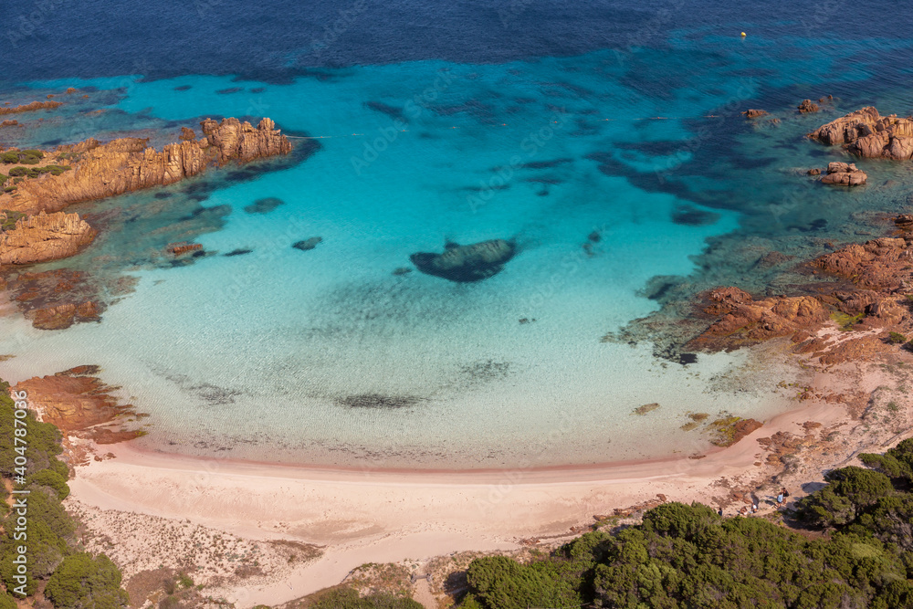 Aerial view of the famous Pink Beach in Arcipelago La Maddalena, Sardinia, unique image high resolution from helicopter