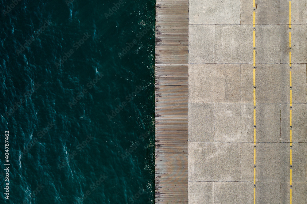 Empty walkway by the sea, aerial view. 