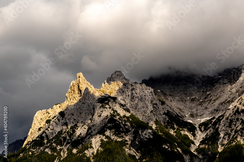 view with the top of mount Karwendel in Germany among heavy clouds