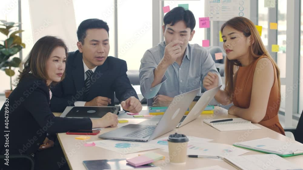Group of Asian business brainstorming, discussion, creative team meeting in the modern workspace. Group of Asian business brainstorming, discussion, creative team meeting in the modern workspace.