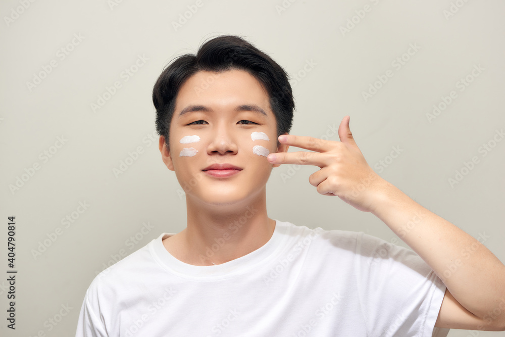 Handsome man applying - anti-aging concept Handsome man applying - anti-aging concept