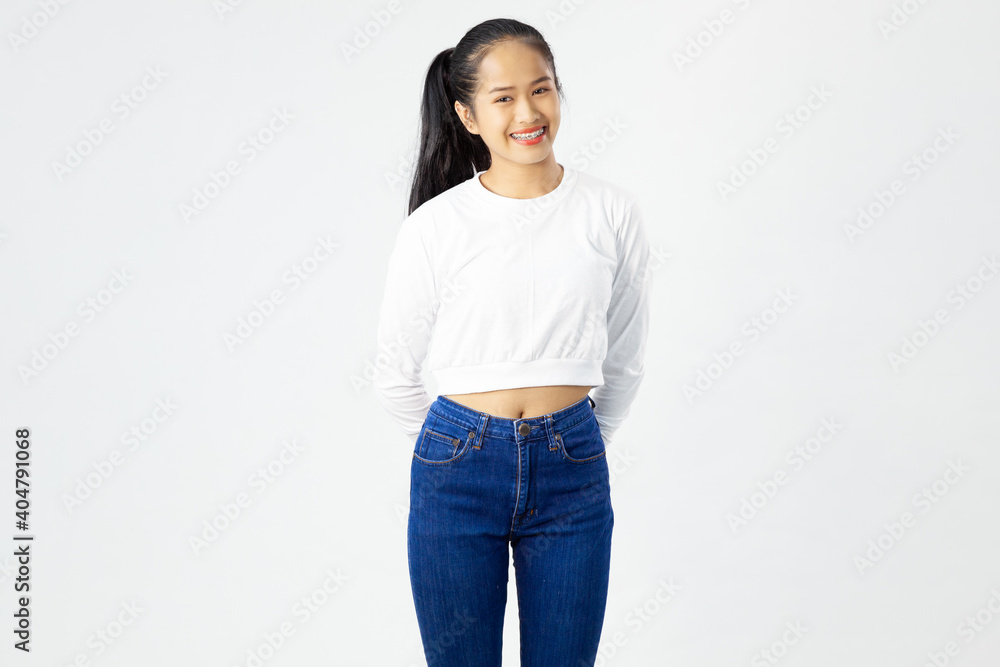 Portrait of a smiling asian woman standing and looking at camera isolated over white background Portrait of a smiling asian woman standing and looking at camera isolated over white background