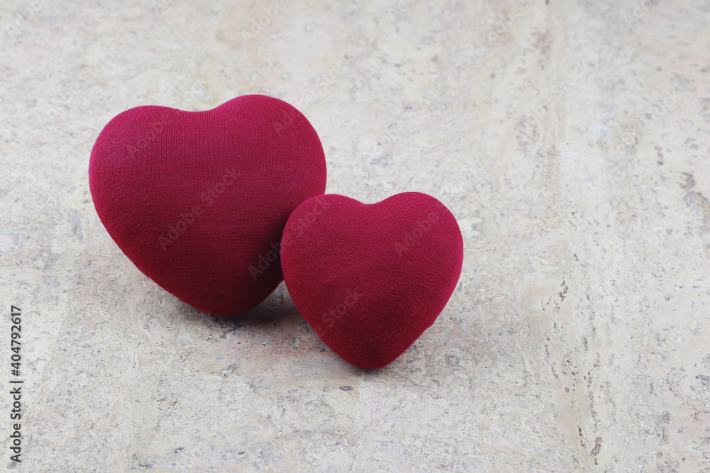 Obraz premium two hearts large and small on a cork background. Love concept. Valentine's Day