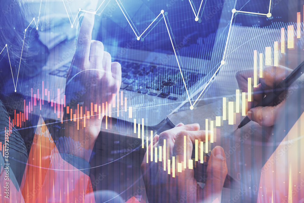 Double exposure of man and woman working together and forex chart hologram. Business concept. Computer background. Double exposure of man and woman working together and forex chart hologram. Business concept. Computer background.