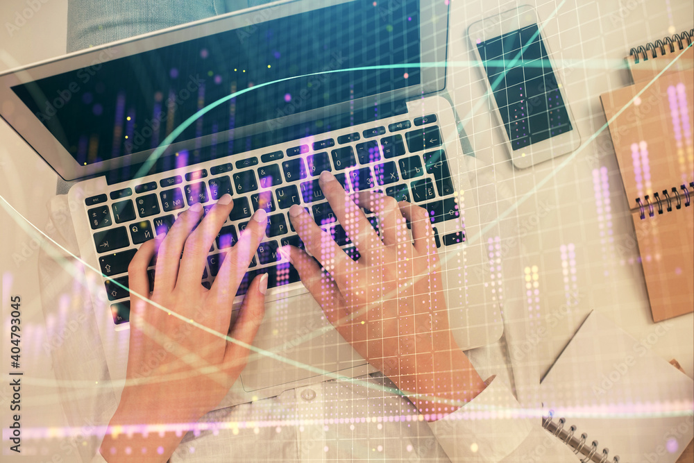 Double exposure of woman hands working on computer and forex chart hologram drawing. Top View. Financial analysis concept. Double exposure of woman hands working on computer and forex chart hologram drawing. Top View. Financial analysis concept.