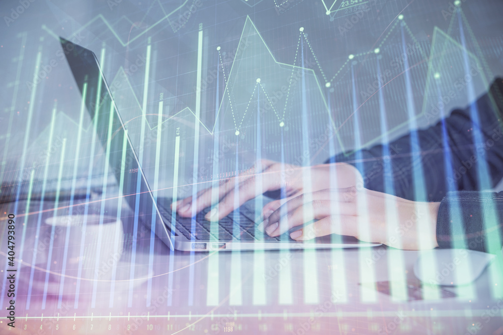 Double exposure of businesswoman hands typing on computer and forex graph hologram drawing. Financial analysis concept. Double exposure of businesswoman hands typing on computer and forex graph hologram drawing. Financial analysis concept.