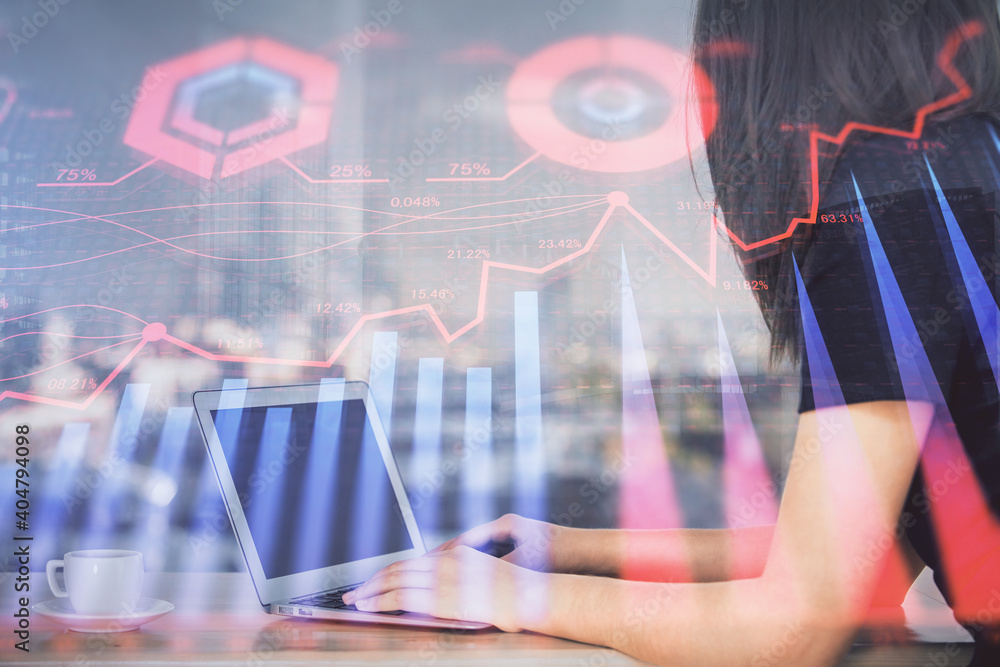 Double exposure of businesswoman hands typing on computer and forex chart hologram drawing. Financial analysis concept. Double exposure of businesswoman hands typing on computer and forex chart hologram drawing. Financial analysis concept.