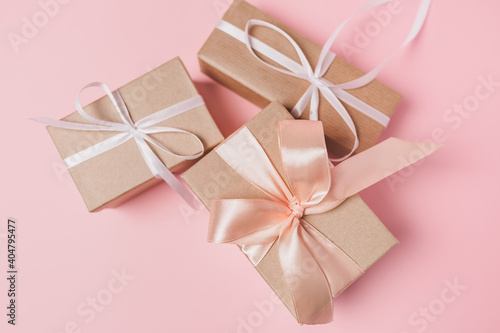 Gifts with wihte ribbon on isolated pink background  love and valentine concept