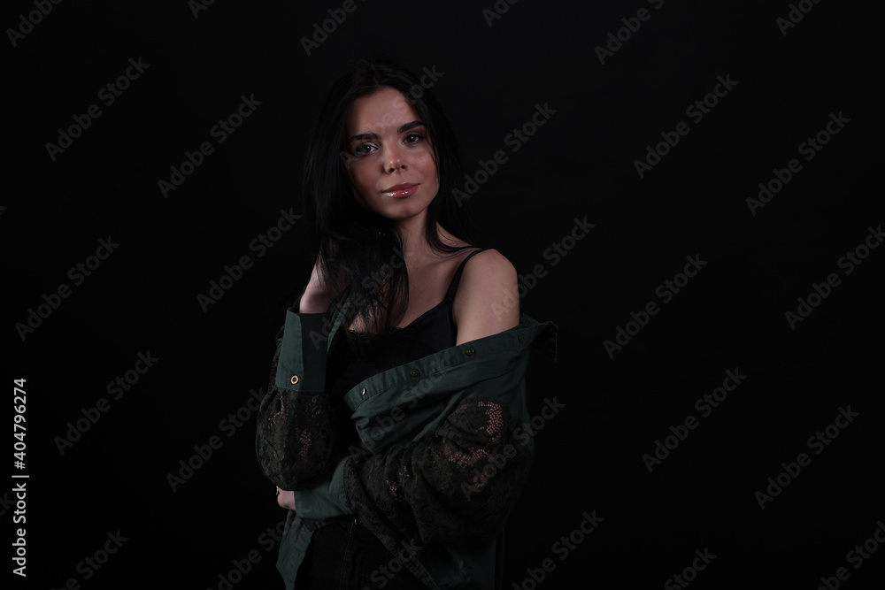 Portrait of beautiful young brunette woman on black background Portrait of beautiful young brunette woman on black background