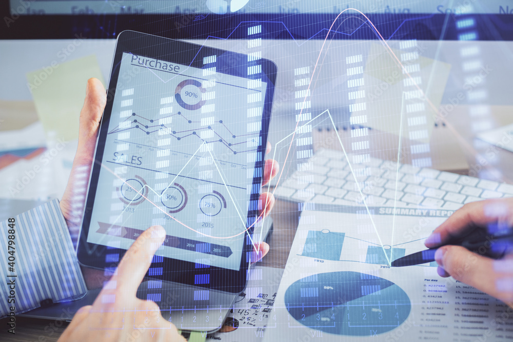 Multi exposure of man's hands holding and using a phone and financial chart drawing. Market analysis concept. Multi exposure of man's hands holding and using a phone and financial chart drawing. Market analysis concept.