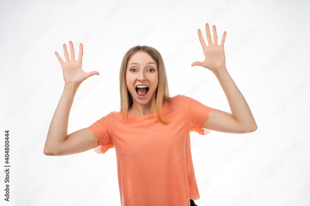 Surprised and happy blond girl express overjoy and surprised, spread hands sideways and smiling, hear amazing info Surprised and happy blond girl express overjoy and surprised, spread hands sideways and smiling, hear amazing info