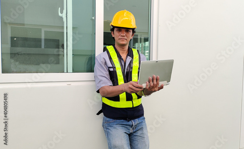 Male Engineer stand holding notebook