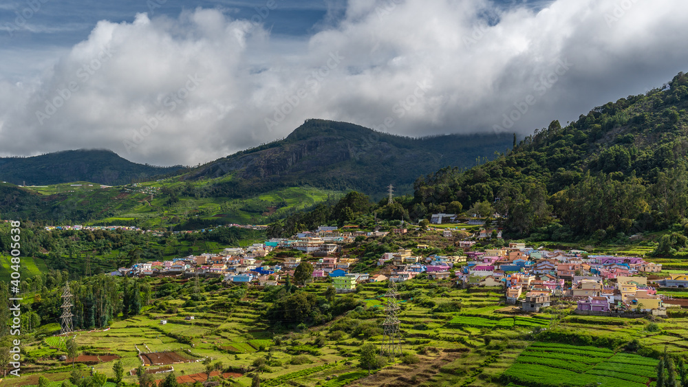 ooty village of  green mountains landscape with sky and clouds . Ooty or Ootacamund or Udhagamandalam is a popular hill station in India
