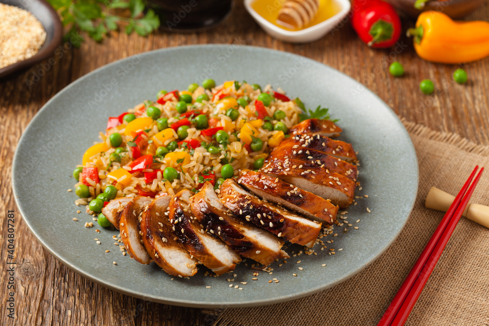 Grilled chicken breast in teriyaki sauce. Served with brown rice and vegetables. Grilled chicken breast in teriyaki sauce. Served with brown rice and vegetables.