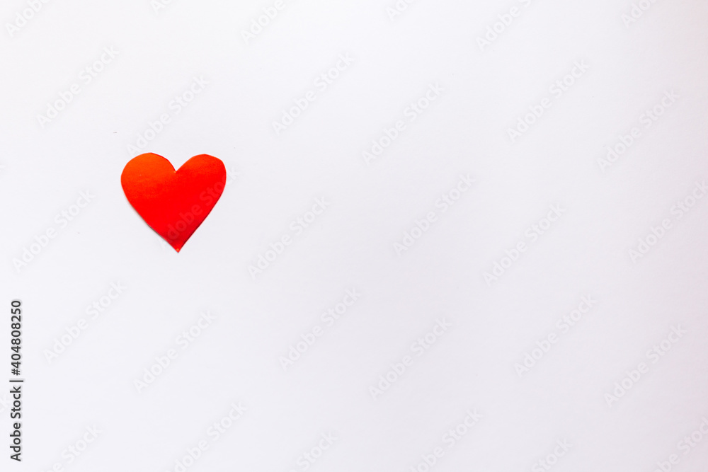 
Red heart on a light background with place for text.
