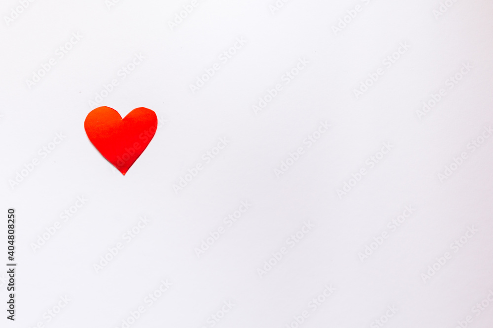 Red heart on a light background with place for text.
Red heart on a light background with place for text.