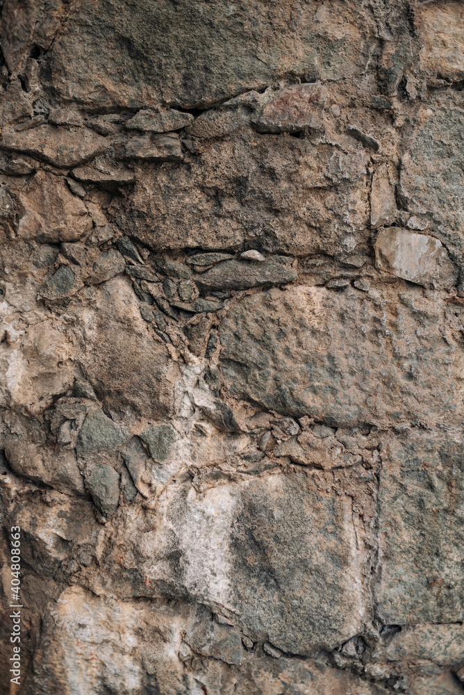 Texture of old gray stone wall background