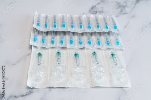 Medical syringes and needles for hypodermic injection in sterile packaging.